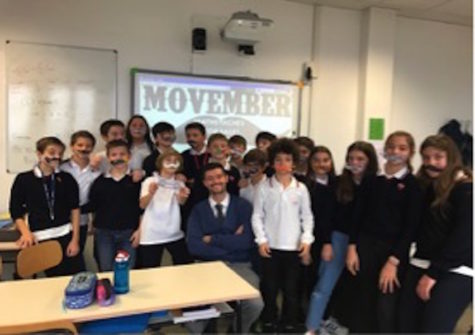 Members of 7B show-off their ‘mathstaches’ with Head of Zeus, Mr. Curran.